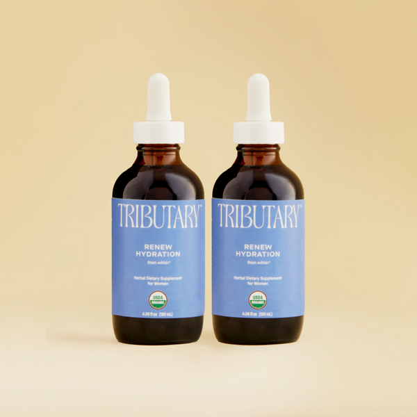 This is a photo of Tributary's Renew Hydration, an organic herbal dietary supplement, taken by mouth, which helps to relieve systemic dryness and renew moisture of feminine areas as well as chapped lips, skin, and hair.